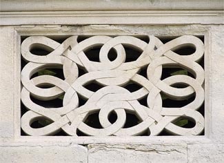 A pierced stone slab.